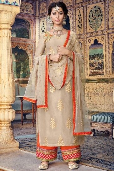 Printed And Embroidered Designer Chanderi Fabric Beige Plazzo Suit With Net Dupatta